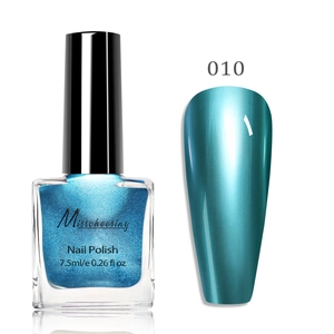 Close-up of peacock blue metallic mirror nail polish with shimmer finish for manicure