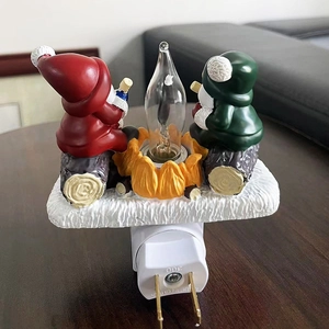 Detail of Christmas gnome night light showing American plug and UL safety certification mark