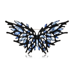 Dark style butterfly brooch with blue crystals and black metal for suits and fashion