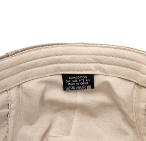 Detailed macro view of the 100% cotton beret inner lining and wash care label details
