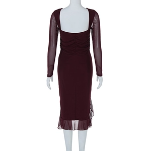 Detail of wine red dress featuring mesh sleeves and ruched back with slit hem design