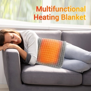 Heating blanket on female model waist showing grid warming effect on grey fabric