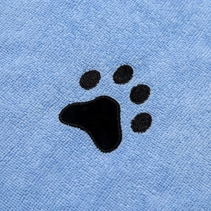 Blue coral fleece pet towel featuring absorbent fabric and black paw print pattern