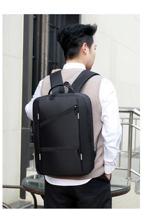 Detail of black business laptop backpack with side USB charging port for commuters
