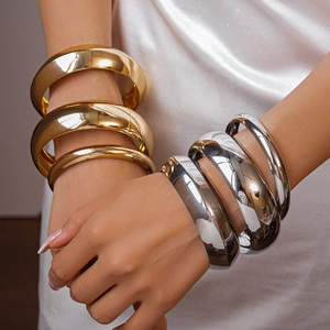 Minimalist thick polished geometric metal bangles set in gold and silver finish