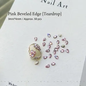 Detail of 3x4mm pink teardrop nail art rhinestones with faceted crystal finish