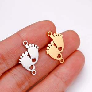 Mirror polished stainless steel baby feet pendants with heart cutout in gold and silver