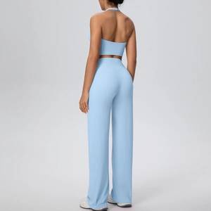 Back view of light blue halter yoga top and high-waisted wide-leg workout trousers