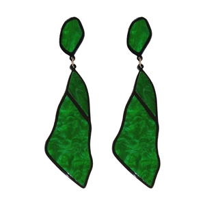 Irregular green acrylic earrings with marble texture and black border on a white background