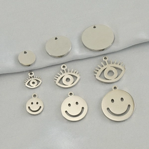 DIY stainless steel pendants in silver with round, eye, and smiley face shapes in three sizes