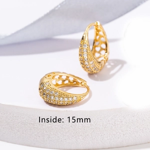 Detail view of 18K gold plated heart hoop earrings with clear crystals and 15mm inner diameter