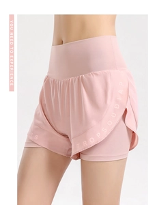 Detail of pink high-waisted double-layered sports shorts with STROPSOUDIAP printed text