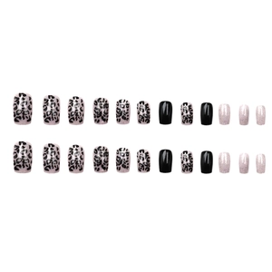 Leopard print and black contrast press-on nails in square oval shape on white background