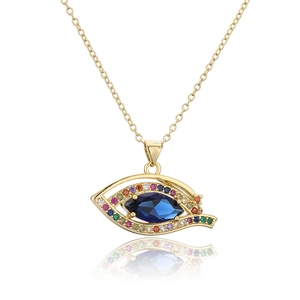 Macro shot of evil eye pendant with blue marquise zircon and multi-colored stones