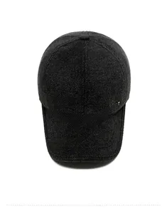 Detail shot of the dark grey wool baseball cap showing thick knit texture and SPORT metal logo