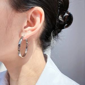Minimalist silver hoop earrings for women with high-shine polished metallic finish