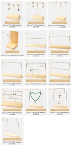 Detail of pine wood base and gold metal earring display stands in various sizes