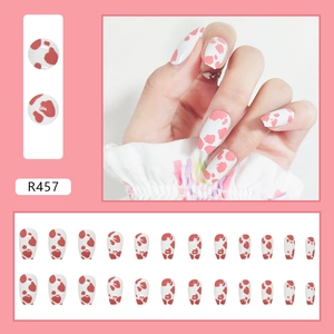 Pink and white cow print short ballerina press-on nails set with 24 pieces included