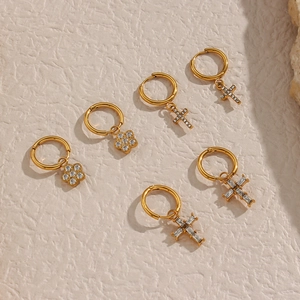 Set of six gold stainless steel earrings featuring cross and flower charms with cubic zirconia