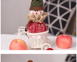 Christmas snowman gift bag with holiday cheers text in a decorative white tricycle