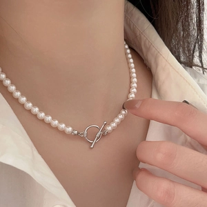 French style 925 sterling silver pearl necklace with OT toggle clasp on female model
