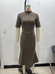 Detail of coffee brown midi dress featuring high neck short sleeves and slim waist belt