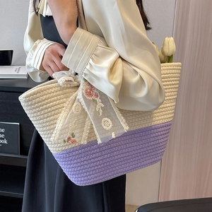 Large woven tote bag in white and purple with floral lace scarf for beach vacation style