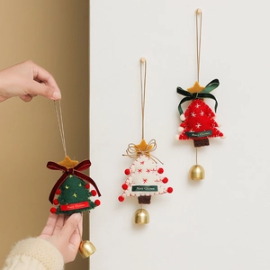 Three felt Christmas tree ornaments with metal bells and Merry Christmas labels