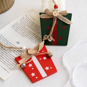 Nordic wooden Christmas tree ornaments with red and green gift box shapes and metal bells
