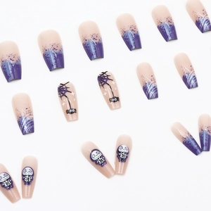 Halloween press-on nails featuring purple gradient, spider web motifs, and skull charms