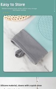 Detail of mint green silicone oven glove featuring a hidden hanging loop for easy storage