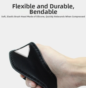 Detail of flexible black silicone body brush showing soft bristles and high elasticity