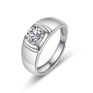 Detailed macro view of men's silver ring featuring a large solitaire round cut diamond
