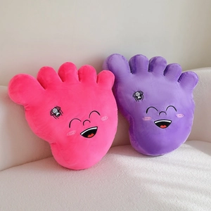 Plush big foot shaped pillows in pink and purple with cute embroidered smiley faces
