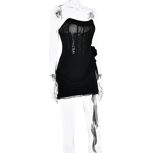 Detailed view of black strapless mini dress with lace fabric and 3D floral accents