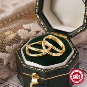 Elegant 925 sterling silver gold double-layer hoop earrings in a luxury green jewelry box