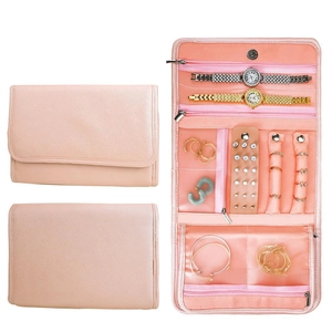 Pink PU leather foldable jewelry travel organizer showing closed and open interior storage
