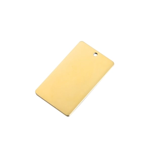 Close-up of polished gold rectangular titanium steel pet tag with smooth mirror finish