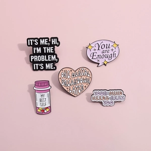 Five mental health themed enamel pins set with motivational quotes on pink background