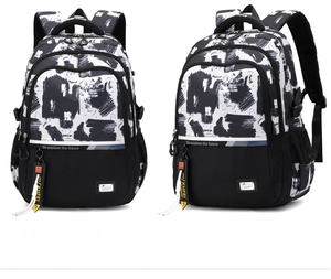 Detail view of graffiti pattern backpack with reflective strips and side mesh pockets