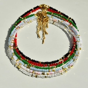 Colorful crystal beaded necklaces with gold accents and pendants for a vibrant summer look