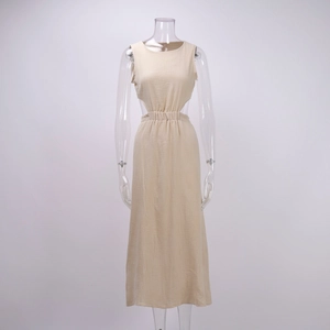 Detail view of double-layered crepe dress with side cutouts and elastic gathered waistline