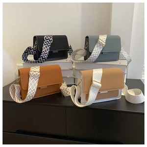 Four retro square crossbody bags in black, blue, brown, and khaki with wide straps