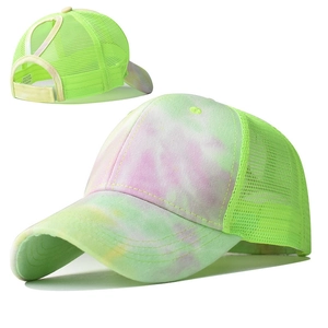Detail view of tie-dye ponytail sun hat with breathable neon green mesh and velcro strap