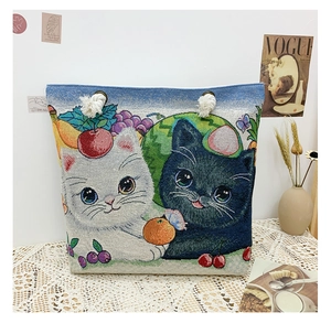 Detail of jacquard tote bag with cat patterns and sturdy cotton rope handles