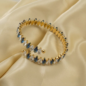 Detail of 18K gold-plated bangle with white and navy blue marquise zircon stones