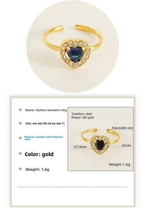 Detail of heart zircon ring in 18K gold plated stainless steel with adjustable band