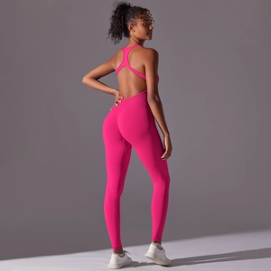 Detail of rose red backless yoga jumpsuit showing racerback straps and slim fit