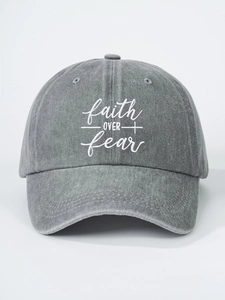 Detailed close-up of gray washed cotton baseball cap featuring white faith over fear embroidery