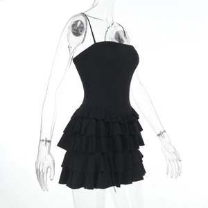 Detail view showing tiered ruffle layers on a sexy black backless mini dress